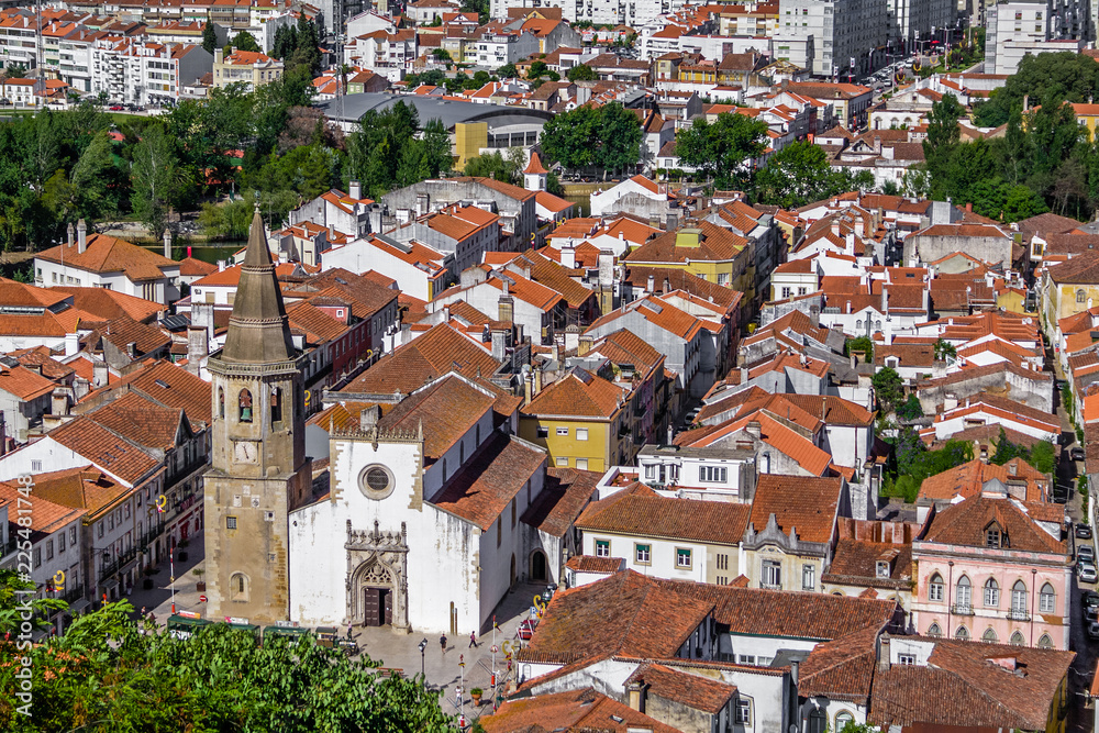 Tomar, Portugal. The city of Tomar with Igreja de Sao Joao Baptista Church and Republica Square. Seen from the Castle of Tomar and Convento de Cristo