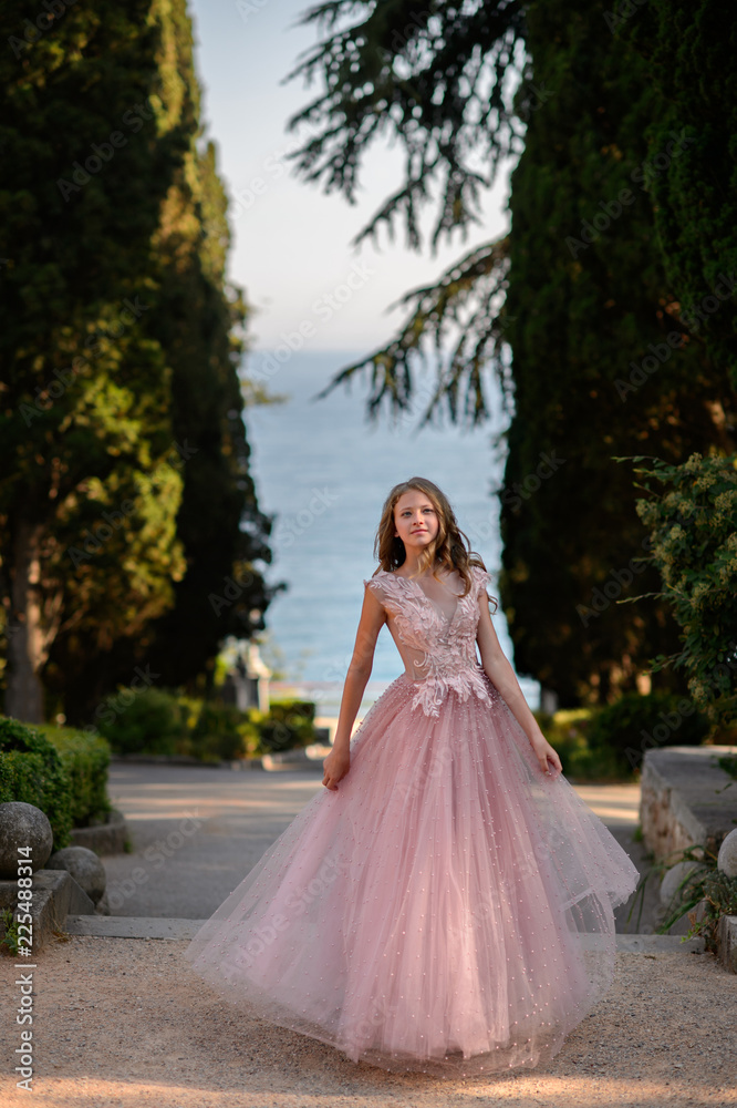 Beautiful girl in amazing dress outdoor. Wedding dress