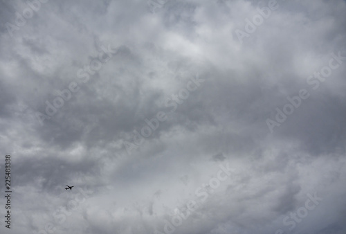 Wallpaper Mural Small jet plane against huge cloudy sky Torontodigital.ca