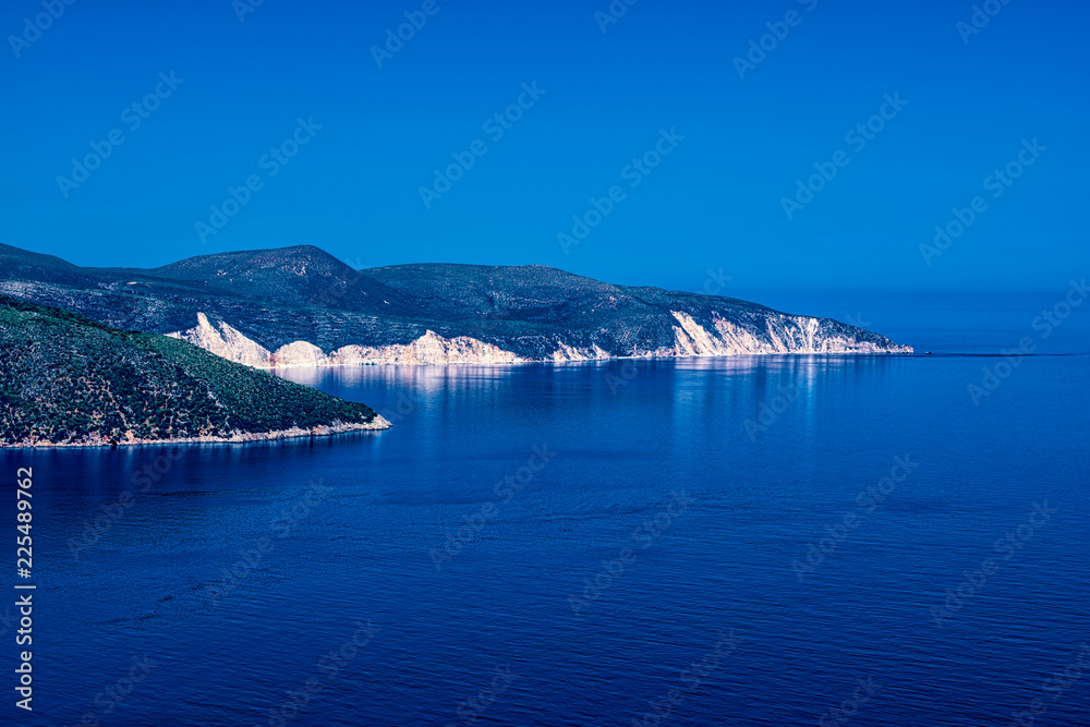 mediterranean landscape, promontory in the deep blue sea
