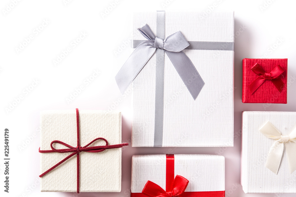 White and red gift boxes isolated on white background. Copyspace White and red gift boxes isolated on white background. Copyspace