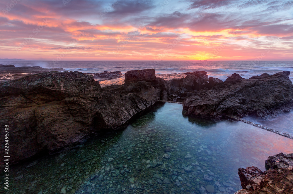 Sunrise skies over Nuns Baths