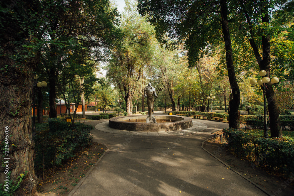 statue of poseidon in the park