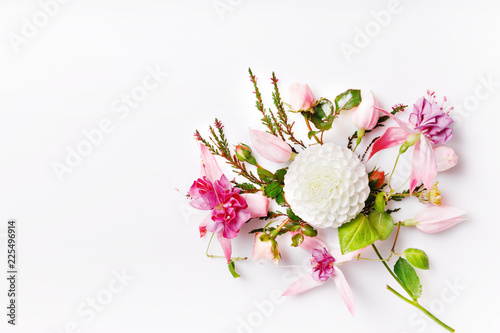 Fototapeta Naklejka Na Ścianę i Meble -  Festive flower white dahlias, pink fuchsia composition on the white background. Overhead top view, flat lay. Copy space. Birthday, Mother's, Valentines, Women's, Wedding Day concept.