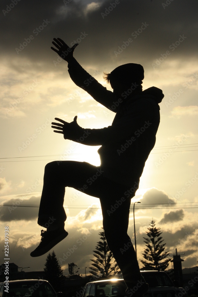 Fototapeta premium silhouette of man on background of white sky
