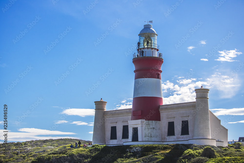 Close up of tourist landmark lighthouse on a hill in the Southern most point of Africa, Cape Agulhas.