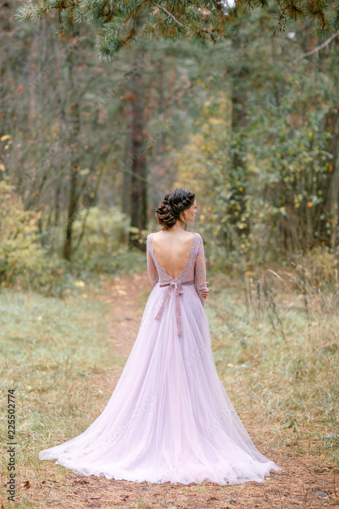 Beautiful bride in pink wedding dress.