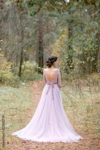 Beautiful bride in pink wedding dress.