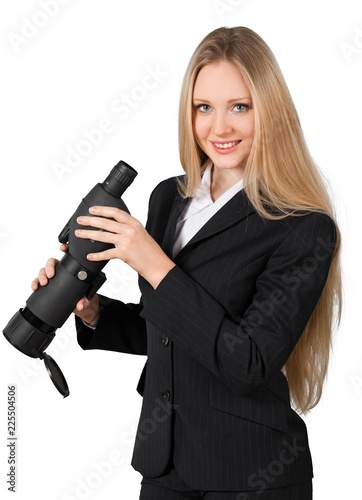 Friendly Young Businesswoman Standing and Holding Telescope -