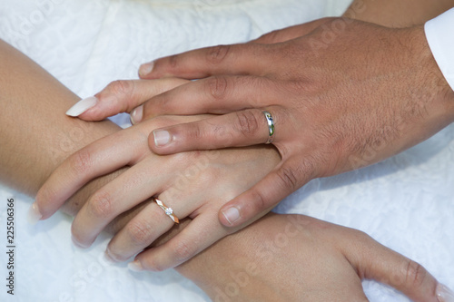 hands of man and woman with wedding ring