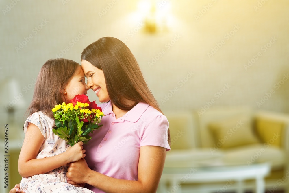Portrait of happy mother and daughter holding Portrait of happy mother and daughter holding