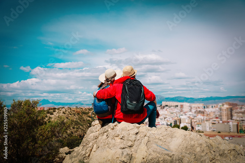 young couple travel in the city looking at panoramic view