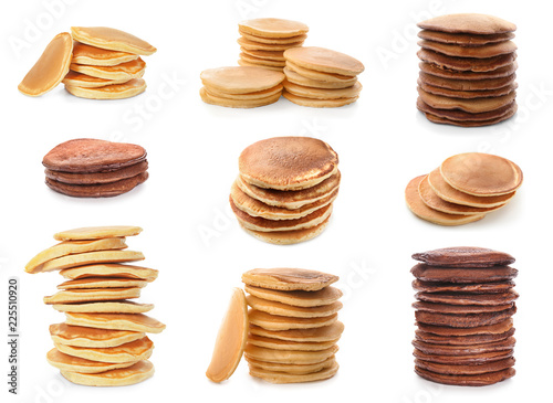 Stacks of tasty pancakes on white background