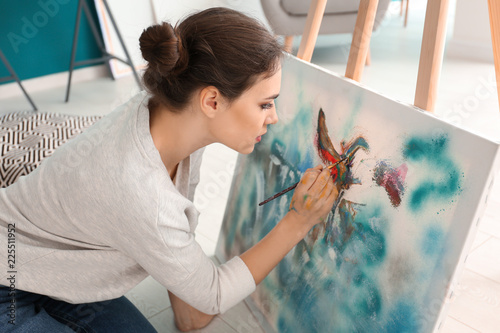 Female artist painting pict...
