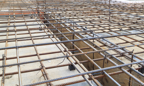 close up view of reinforcement of concrete with metal rods connected by wire. Preparation for pouring the Foundation