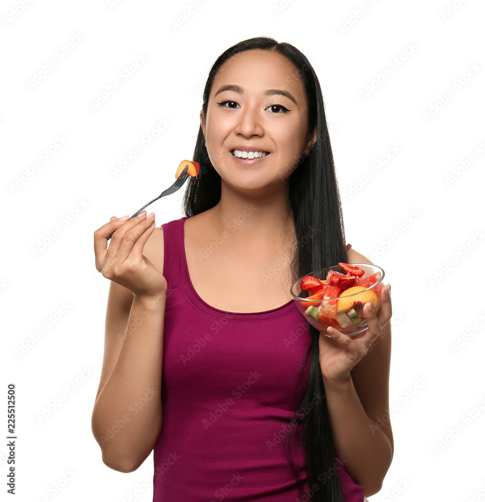 Asian woman with healthy fruit salad on white background Asian woman with healthy fruit salad on white background