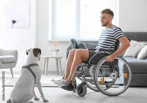 Young man in wheelchair wit...