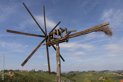 vineyard with windmill called klapotetz in south of styria,austria. old wine growing area named suedsteirische weinstrasse
