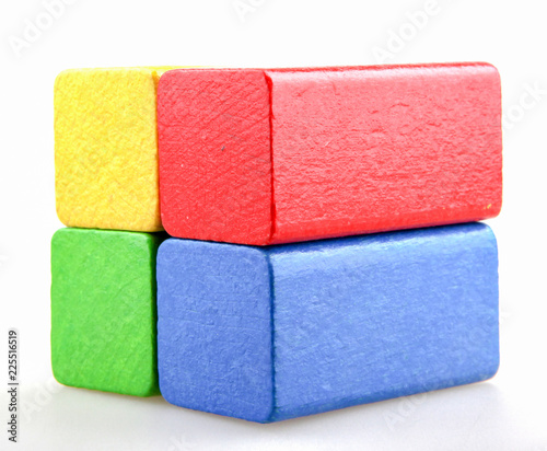 Wooden building blocks isolated on white background.