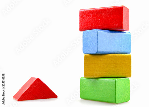 Wooden building blocks isolated on white background.