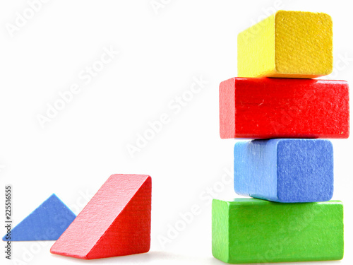 Wooden building blocks isolated on white background.