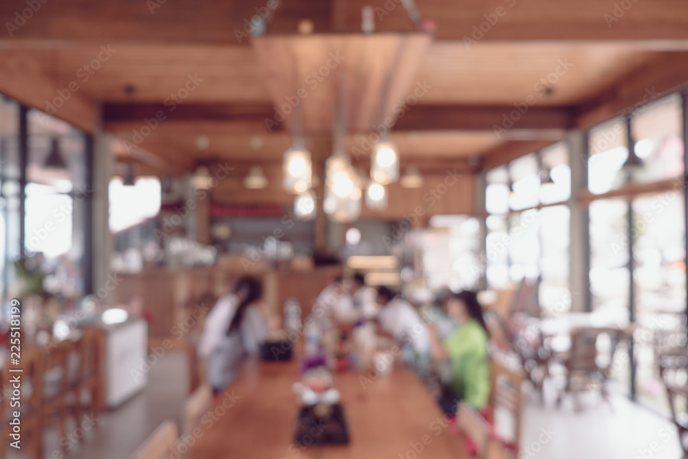 Abstract blur image of Coffee shop or restaurant with bokeh for background usage.