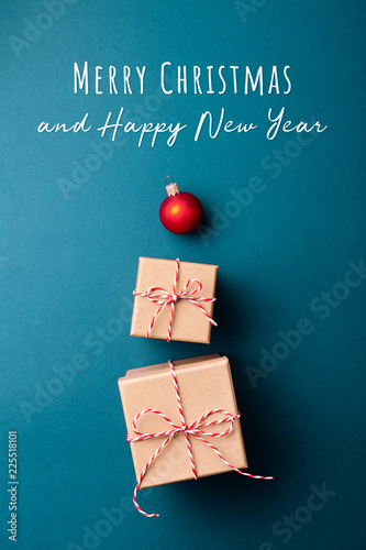 Gift boxes wrapped in kraft paper and tied with candy cane Christmas rope and...