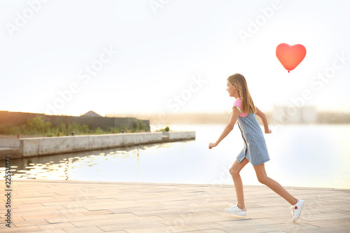 Cute little girl playing wi...