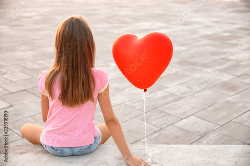 Cute little girl with heart...