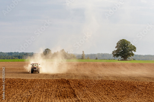 tractor handles land, very put © Normunds