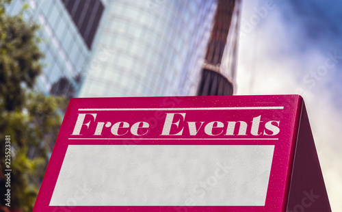 free events sign with skyscraper blur background, cartello pubblicitario per eventi gratis, con grattacieli sfuocati sullo sfondo photo