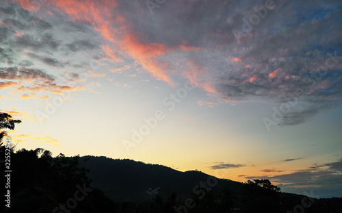 Spectacular sunset over mountains and trees on a tropical island   © mizuno555