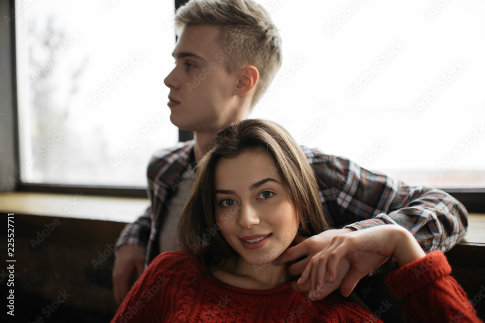 Beautiful lovely couple hugging at cozy comfortable home. Portrait of young cheerful woman with beautiful face looking at camera. Harmony. Relationship. Beautiful lovely couple hugging at cozy comfortable home. Portrait of young cheerful woman with beautiful face looking at camera. Harmony. Relationship.