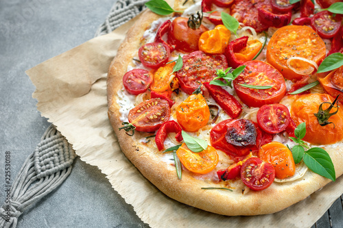 Tomato pizza with ricotta cheese.