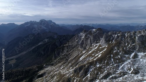 Aerial - Flying over Alpine landscape with mountains in autumn photo