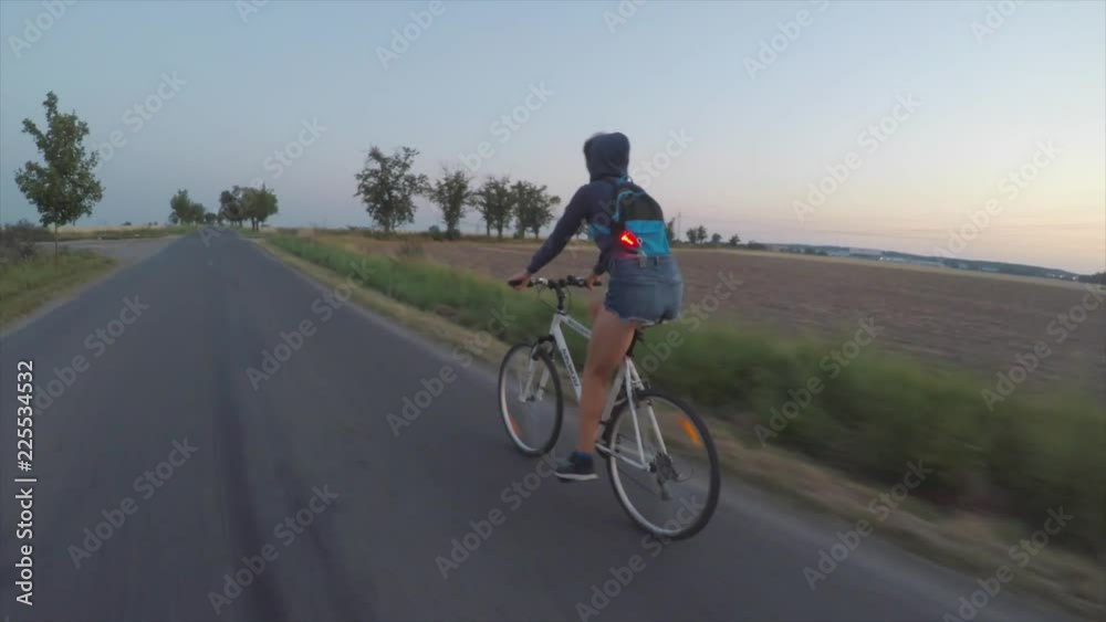 Self-isolation, quarantine of viral infection COVID 19. Healthy lifestyle. Girl riding a bike on the road. Self-isolation, quarantine of viral infection COVID 19. Healthy lifestyle. Girl riding a bike on the road.