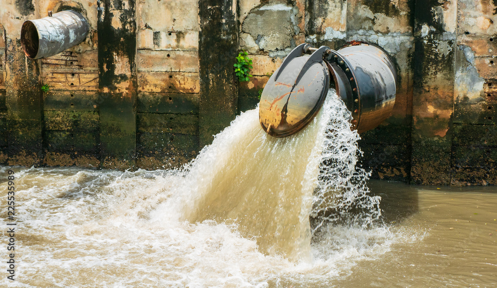 custom made wallpaper toronto digitalThe large drain of the city is draining the wastewater into the canal, flowing into the sea, as a result of environmental issues in environment and ecology concept.