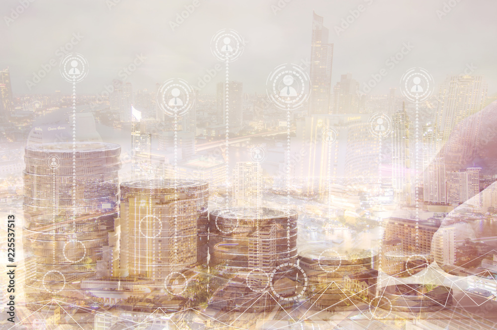 Finance and investment concept, Double exposure of finger putting and stacked of coins and night city