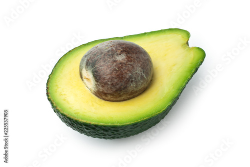 Half avocado with seed isolated on white