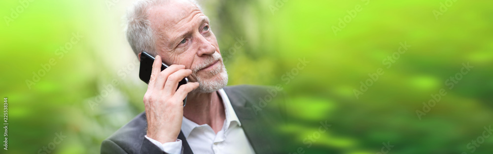 Portrait of mature man talking on mobile phone Portrait of mature man talking on mobile phone