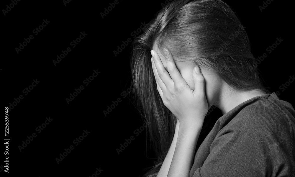 Young woman crying on background Young woman crying on background