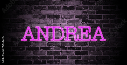 first name Andrea in pink neon on brick wall