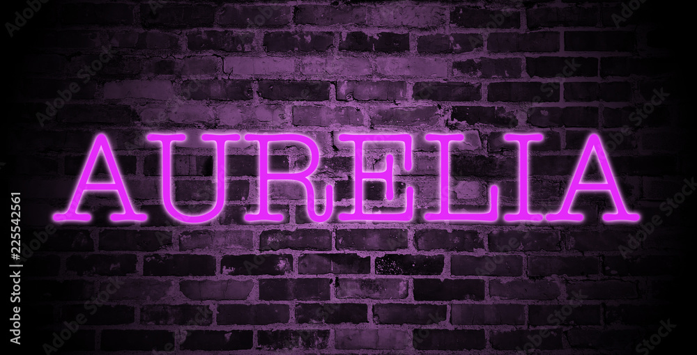 first name Aurelia in pink neon on brick wall