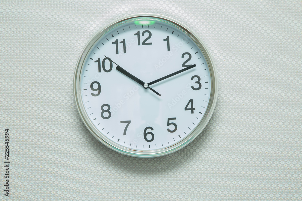 Time Punctual Second Minute Hour Concept . Wall white clock and shelf at abstract white background . close up of an office clock on white background with clipping path Time Punctual Second Minute Hour Concept . Wall white clock and shelf at abstract white background . close up of an office clock on white background with clipping path