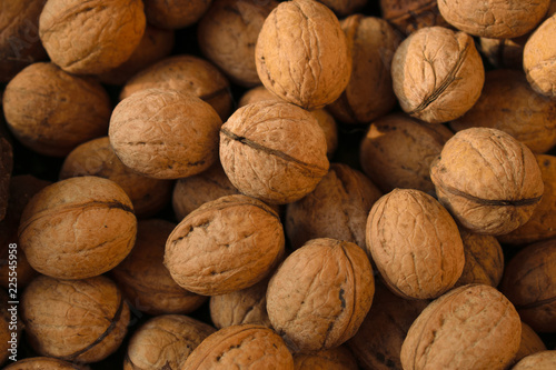 Natural abstract background of walnuts in shell