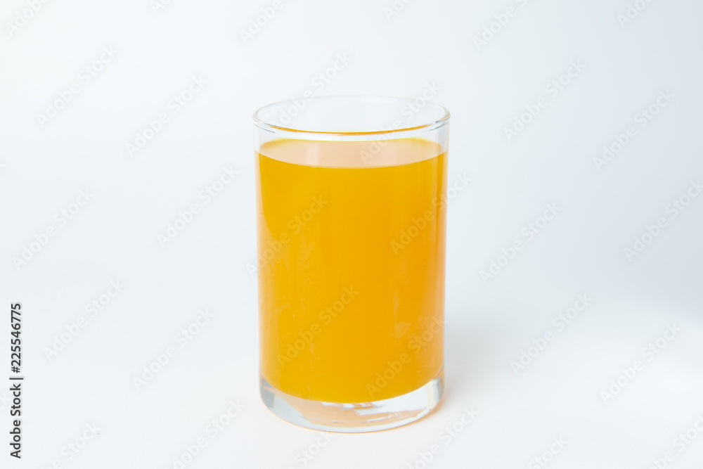 Orange juice in the glass on white background isolate. Orange juice in the glass on white background isolate.