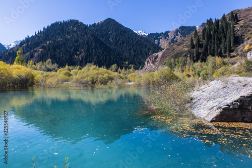 clear water with mountans reflection in Issyk lake in Kazakhstan