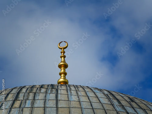 Crescent moon at a top of a mosque of Hagia Sophia in Istanbul. Islamic symbol clouse up