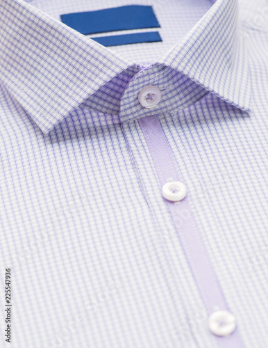 purple shirt with focus on collar and button, close-up