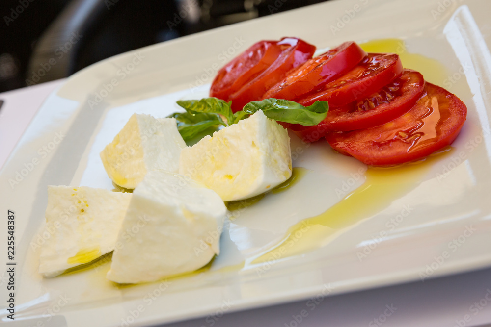Buffalo mozzarella, tomato and basil salad dressed with extra virgin olive oil. Buffalo mozzarella, tomato and basil salad dressed with extra virgin olive oil.